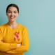 Healthtech PR professional with pink ribbon symbol