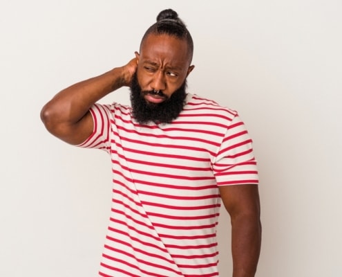 African,American,Man,With,Beard,Isolated,On,Pink,Background,Touching