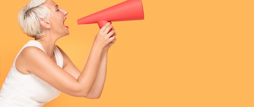 Middle,Age,Elegant,Woman,Shouting,Loud,By,Red,Megaphone,,Smiling,