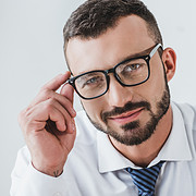 Portrait,Of,Smiling,Handsome,Businessman,In,Glasses,Looking,At,Camera