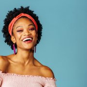 Portrait,Of,A,Happy,Young,Woman,With,Loop,Earrings,Laughing