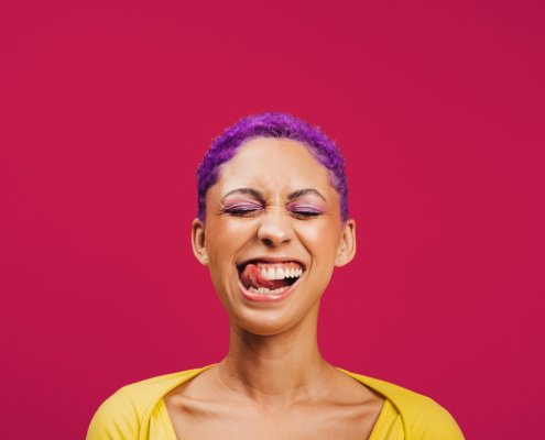Quirky,And,Vibrant.,Excited,Young,Woman,Sticking,Her,Tongue,Out