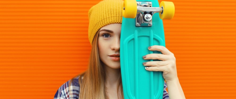 Portrait,Of,Stylish,Young,Girl,With,Skateboard,In,Yellow,Hat,