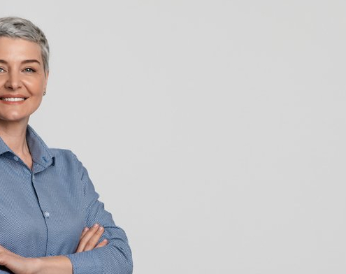 Potrait of a mature businesswoman smiling with her arms crossed