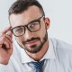 Portrait,Of,Smiling,Handsome,Businessman,In,Glasses,Looking,At,Camera