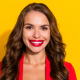 Photo of a cheerful young woman smiling at the camera